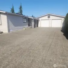 Huge concrete driveway and oversized 2 car garage.