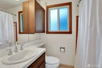 Full bath in the hall, also has 2nd vanity and full size storage closet