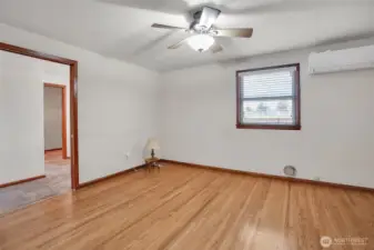 Primary bedroom looking into primary bath and walk in closet.