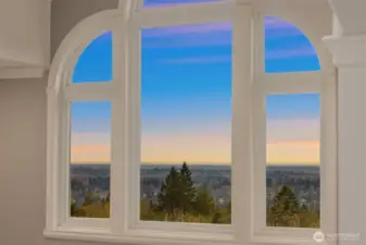 Grand windows above the front door fill the entryway with natural light and amazing views from upstairs.