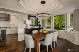 The formal dining room has a gorgeous chandelier and tray ceilings.