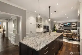This big kitchen has double ovens (innovative steam bake), a built in microwave and wine refrigerator. The formal dining room also has a built-in china cabinet.