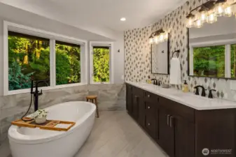 A soaking tub so private, no shades are needed. But for those who want them, each window does have roller shades.