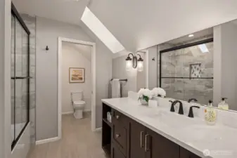 Full bathroom on the 2nd floor with a southwest facing skylight.
