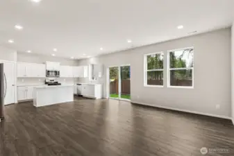 Stunning open-concept layout showcasing the full kitchen with great room that will be great for entertaining. Photos are representative only and may display different color packages and/or upgrades.