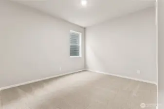 Generously sized secondary bedroom. Photos are representative only and may display different color packages and/or upgrades.