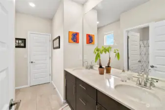 Say goodbye to morning traffic jams and hello to streamlined efficiency as you enjoy the convenience of dual sinks in this upstairs bathroom.