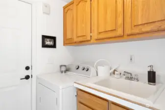 Laundry room with laundry sink.  Washer and dryer stay.