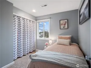 A cozy and well-appointed bedroom offering comfort and privacy.