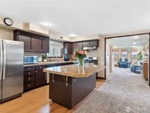 The flow of this home is conducive to entertaining and relaxing, with a full bath between the dining area and family room.