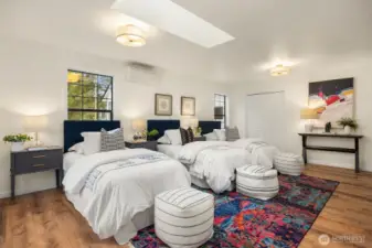 large second floor bedroom with great light and sitting area.