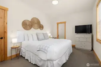Upper level primary suite with attached bath and territorial views