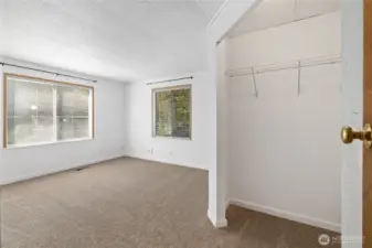 1st bedroom with large corner closet, new flooring throughout and new windows too!