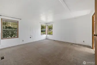 Primary bedroom, new windows, new flooring tons of light in here!