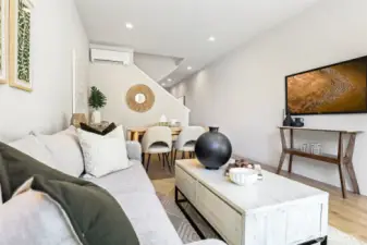 This living space maximizes design and livability from the TV wall to the dining nook.
