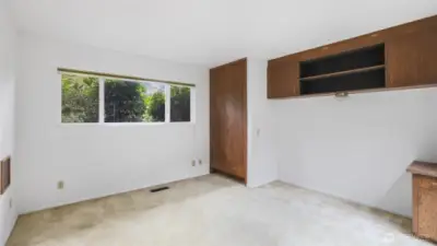 Guest bedroom #1 with practical built-ins.