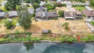Soaring view of the home and amazing neighborhood that lines the river.