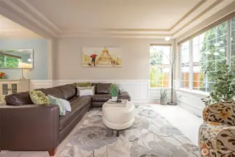 Living Room with Coffered Ceiling & Wall of Windows.