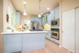 Kitchen with newer Stainless-Steel Appliances & Pantry.