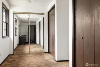 Primary suite closets with large dressing flows into bathroom.