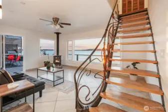 One of a kind custom wood and wrought iron staircase is a work of art.