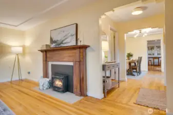 Fireplace is a great source of heat in the winter. Original wood mantle with timelines tile surround.