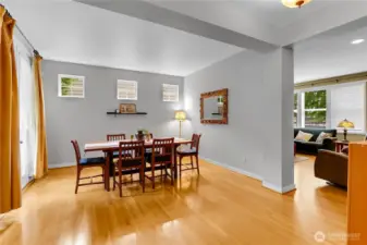 The formal dining room is located next to the family room and has three small windows that let in natural light.