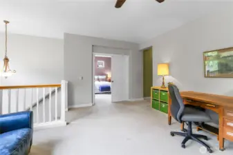 At the top of the stairs there is an open den/office which has two large windows overlooking the front of the home and three smaller windows overlooking the side of the home.