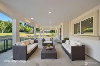 640 SF Covered Patio that opens up to the backyard. Huge Lot