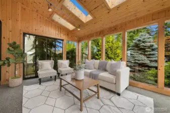 Fabulous sunroom connects main living area and backyard oasis