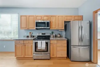 Stainless steel appliances, including the new refrigerator stay with the home.