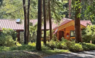Rambler style custom Pan Abode cedar home,with skylights and lots of windows.