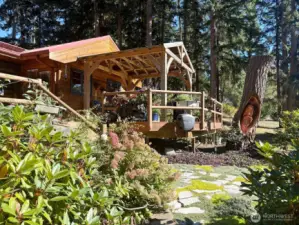 The SW side of the home features an amazing 937 sq foot deck, with covered pavillon. Come see this magical space to enjoy day, night and all year around.