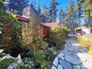 Stunning river rock fireplace inside and out.
