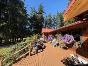 The primary bedroom is large, w/vaulted ceilings and opens to the deck.