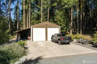 Over 1000 sq foot shop, with an attached carport, two very tall garage doors, inside are 2 hobby/office space, and there is a large upstairs storage area too.  Come inside and take a look!