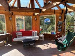 Inside the glassed gazebo is a wonderfully bright, sunny area!  This is just 309 sq feet, but with the outside deck and huge windows, it feels larger. In the winter sun, the gazebo heats up nicely!