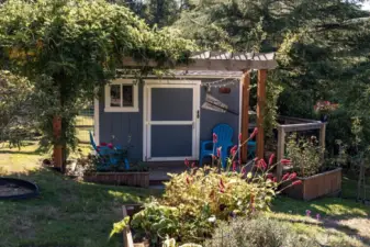 Garden shed with deck space.  What is inside this door?