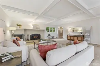 Huge living room with wood burning fireplace.