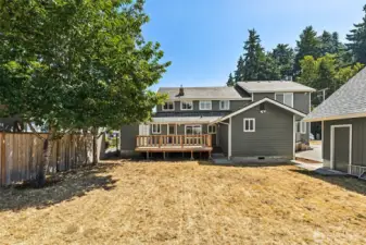 With a level, partially fenced backyard, this space is ready to be transformed into your outdoor oasis. Imagine a flourishing garden, a play area for kids, or a cozy spot for entertaining family and friends. The possibilities are wide open, giving you the perfect place to enjoy the great outdoors.