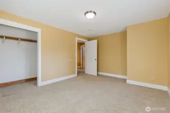 There is also an upstairs hallway in Unit B just outside this Bedroom #1. The hallway is more than just a pass-through space. It has room for a small desk area, a reading nook, or a set of library bookcases for all your favorite reads. The added linen closet provides convenient storage, making this hallway a useful and adaptable spot in the home.