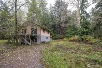 Investment opportunity! 5 acres available east of Oak Harbor. Home needs extensive repairs but has potential.