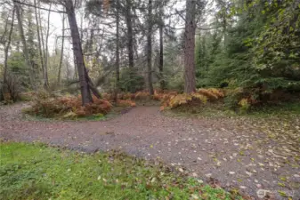 Resurfaced driveway with parking spot.