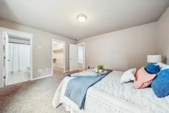 Primary suite with HUGE walk in closet & private bath.