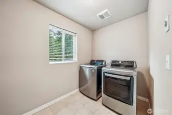 Convenient upper level laundry.