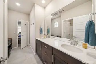 Main bath upstairs with door to bedroom 5