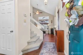 Entryway with half balf to your left and coat closet.