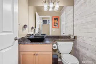 Half bath on main level has an add'l door to your right for storage under the stairs.