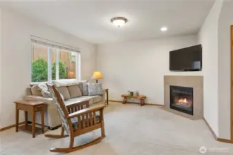 Living room features a cozy fireplace!