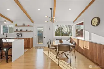 Showcasing the custom buffet to the right with matching cabinetry and counters perfect for entertaining, lets step outside to the upper deck